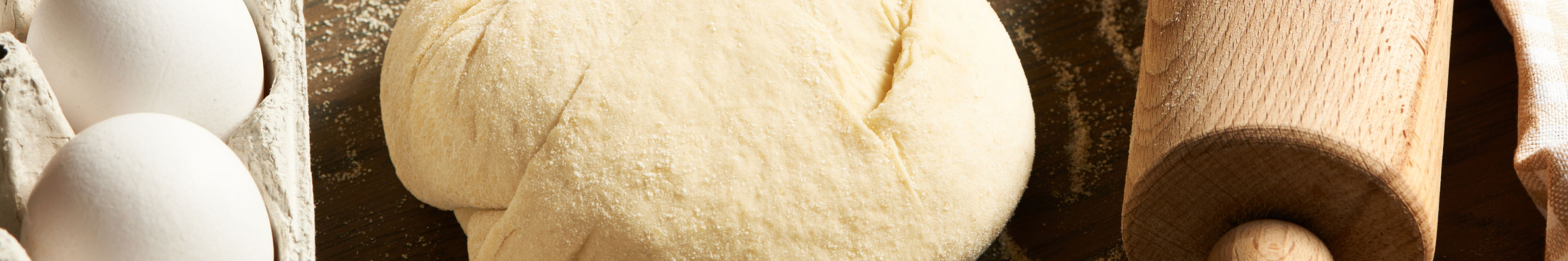 Dough and ingredients on table